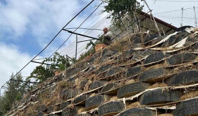 Atık lastiklerle kale gibi duvar ördü